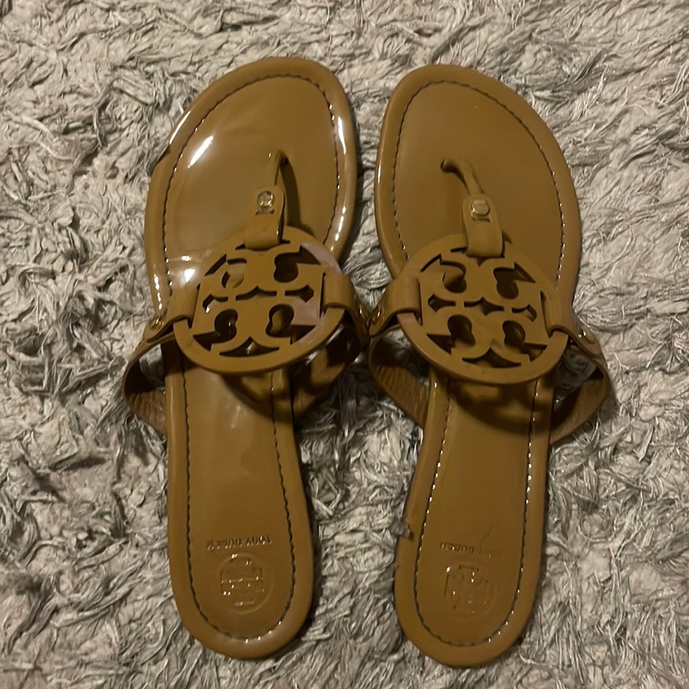 Black patent leather flip flops